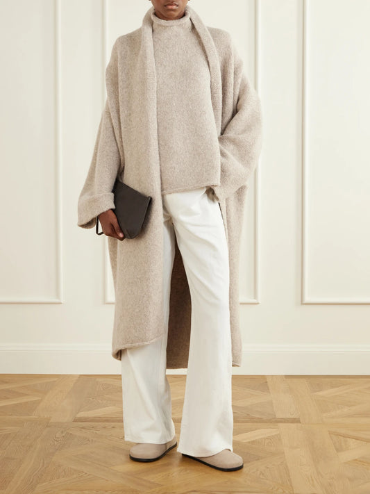 Image of a model wearing Outerwear. Product name - Alpaca-blend Turtleneck Tank in Light gray colour by brand - Lauren Manoogian