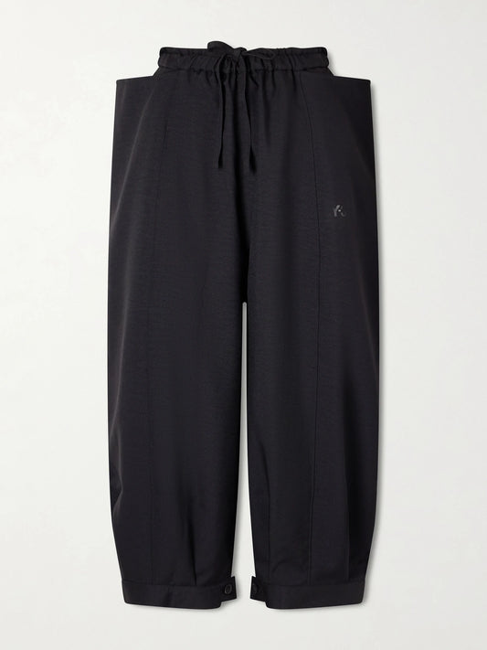 Image of a model wearing Tops. Product name - + Y-3 Cropped Recycled-jersey Wide-leg Pants in Black colour by brand - adidas Originals