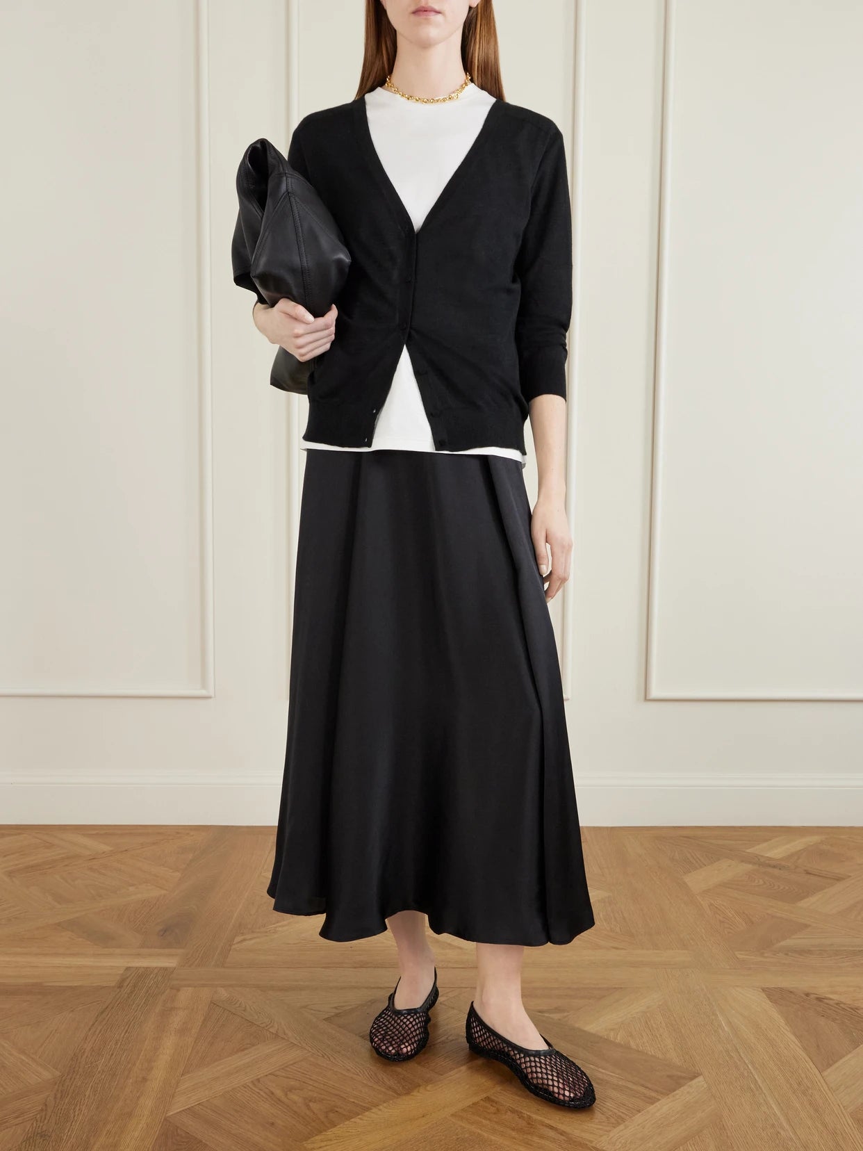 Image of a model wearing Outerwear. Product name - Marisol Cashmere Cardigan in Black colour by brand - Arch4