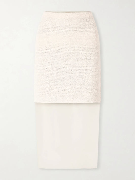 Image of a model wearing Skirts. Product name - Sybil Layered Cotton-blend Bouclé And Organza Midi Skirt in Neutral colour by brand - KHAITE