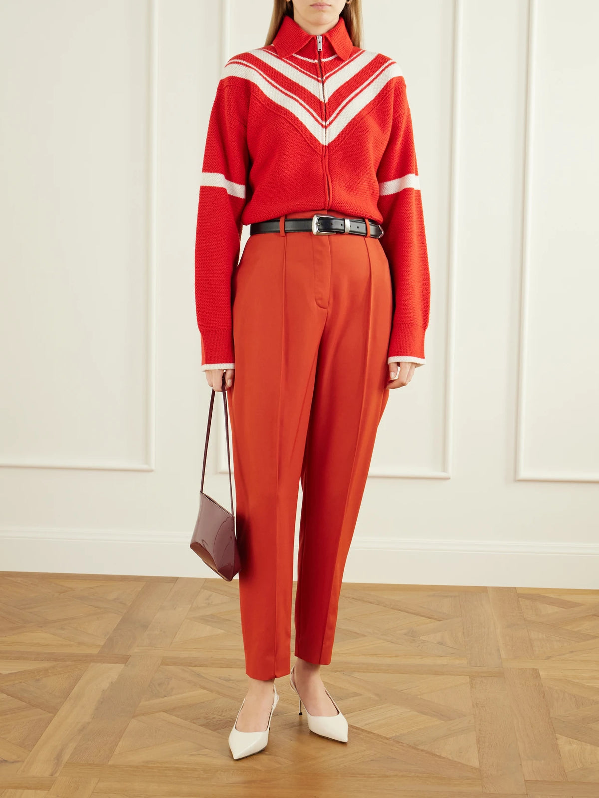 Image of a model wearing Pants. Product name - Tapered Wool Pants in Orange colour by brand - Stella McCartney
