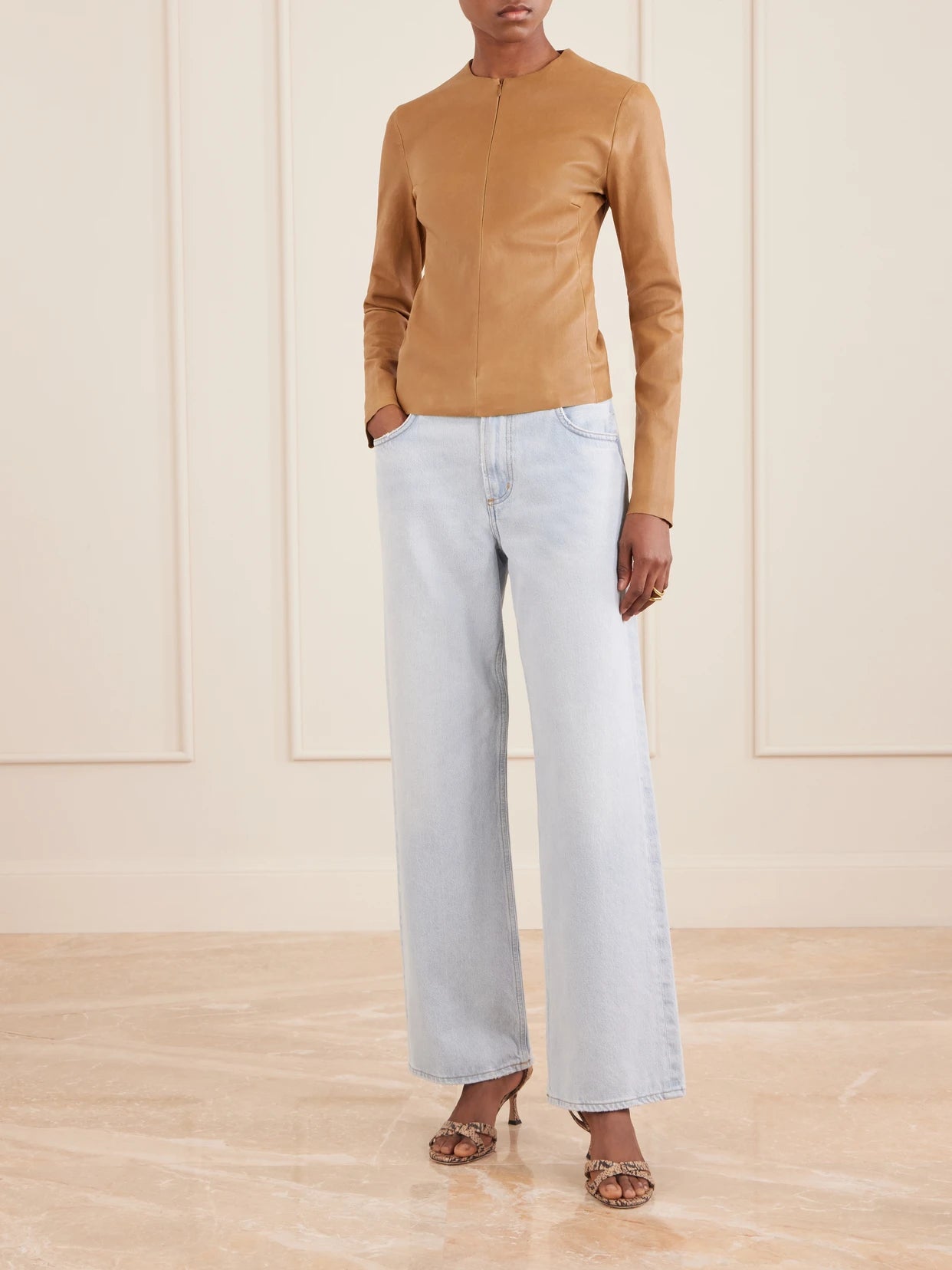 Image of a model wearing Tops. Product name - Imany Leather Top in Light brown colour by brand - STOULS