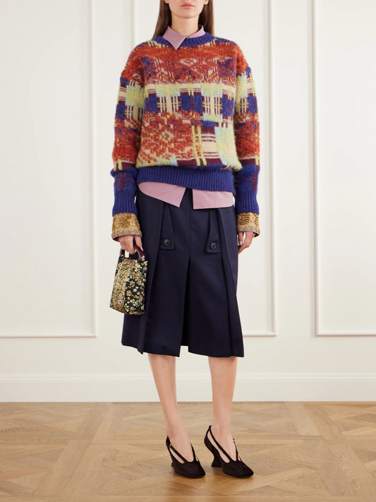 Image of a model wearing Skirts. Product name - Pleated Wool And Cotton-blend Midi Skirt in Navy colour by brand - Dries Van Noten