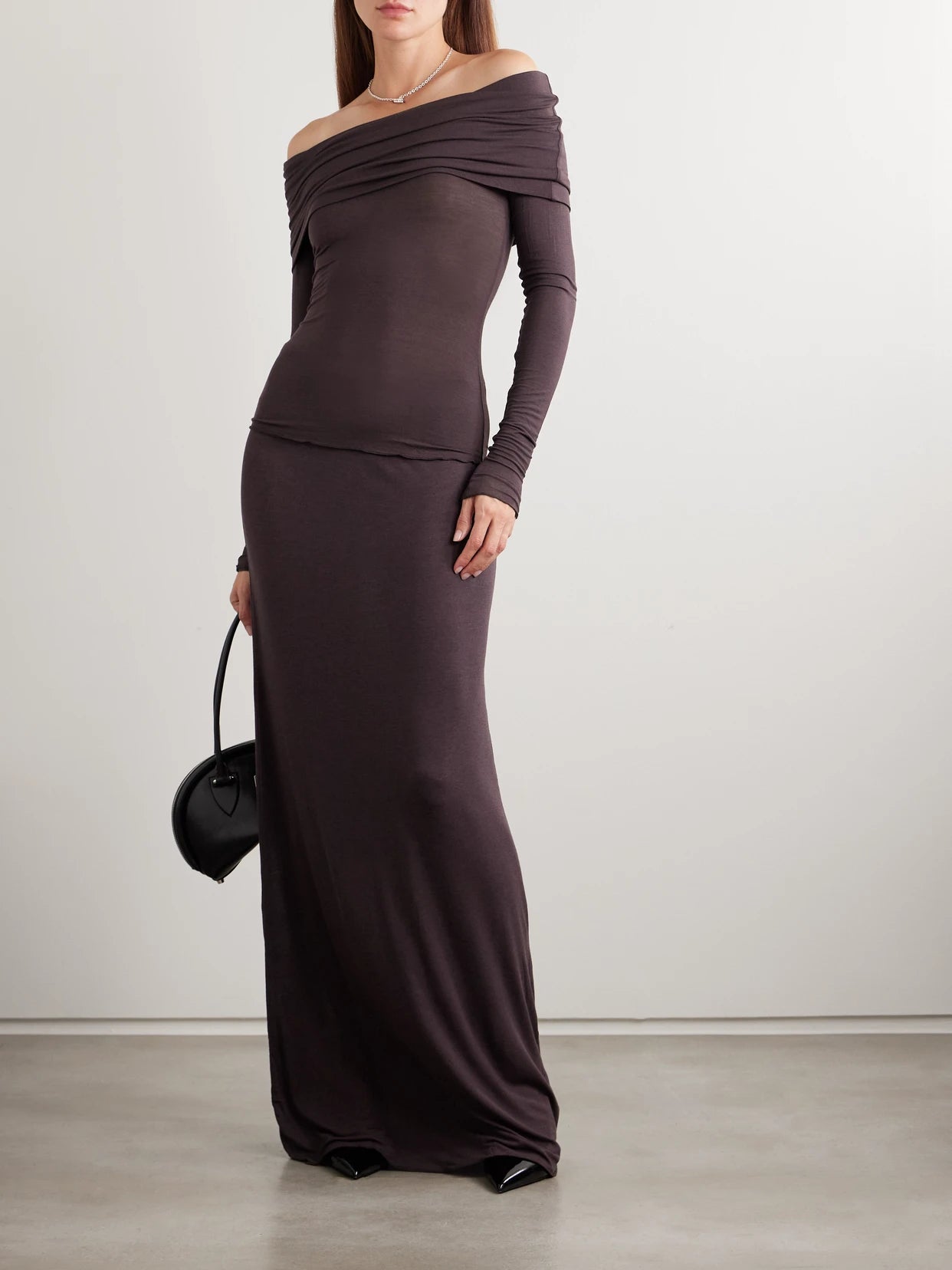 Image of a model wearing Skirts. Product name - Sheer Modal-blend Long Skirt - Phoenix in Brown colour by brand - SKIMS