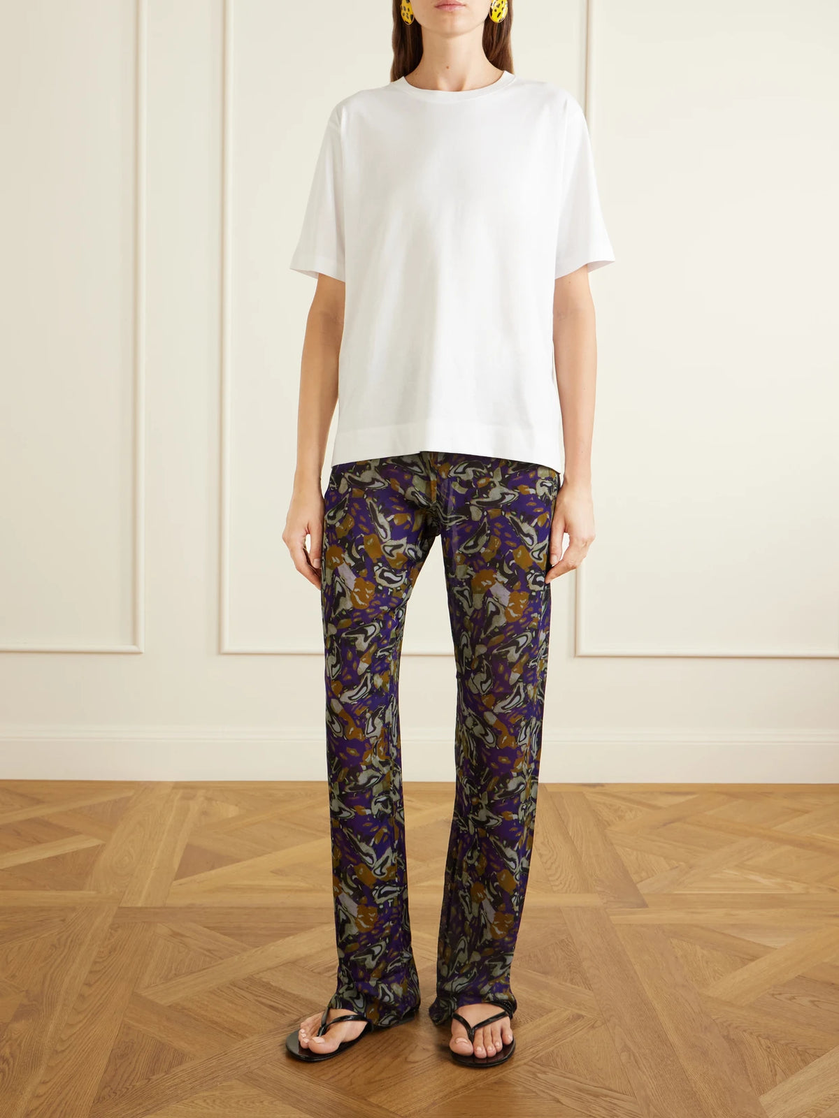 Image of a model wearing Tops. Product name - Cotton-jersey T-shirt in White colour by brand - Dries Van Noten