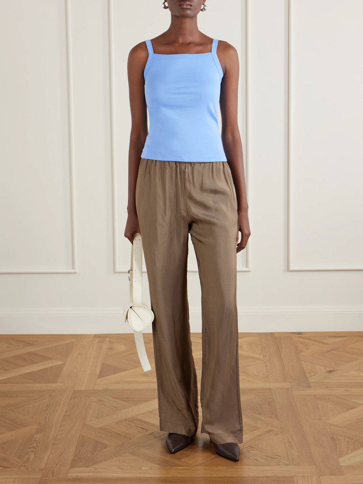 Image of a model wearing Tops. Product name - May Organic Cotton-jersey Tank Top in Blue colour by brand - FLORE FLORE