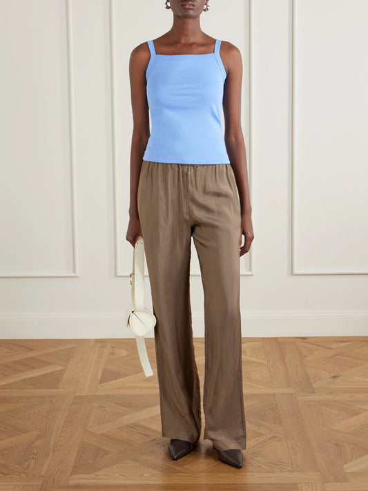 Image of a model wearing Tops. Product name - May Organic Cotton-jersey Tank Top in Blue colour by brand - FLORE FLORE