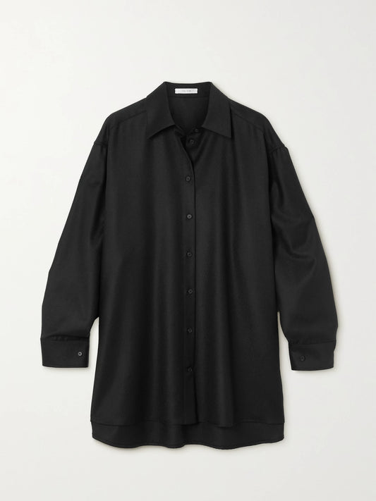 Image of a model wearing Tops. Product name - Essentials Caroline Oversized Wool Shirt in Black colour by brand - The Row