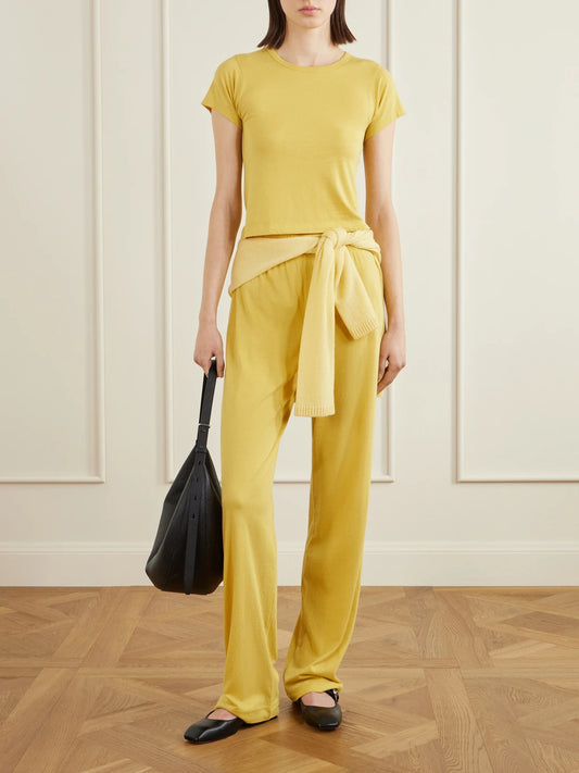 Image of a model wearing Tops. Product name - Cotton And Modal-blend T-shirt in Yellow colour by brand - ÉTERNE