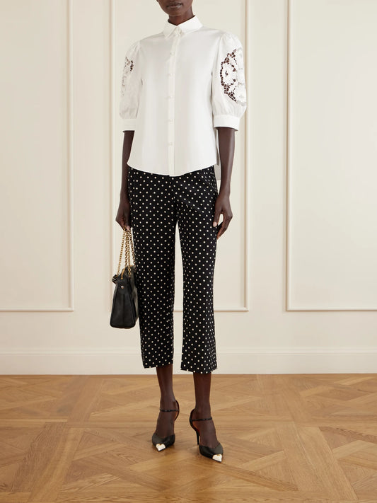 Image of a model wearing Tops. Product name - Broderie Anglaise-trimmed Cotton-poplin Shirt in White colour by brand - Valentino Garavani
