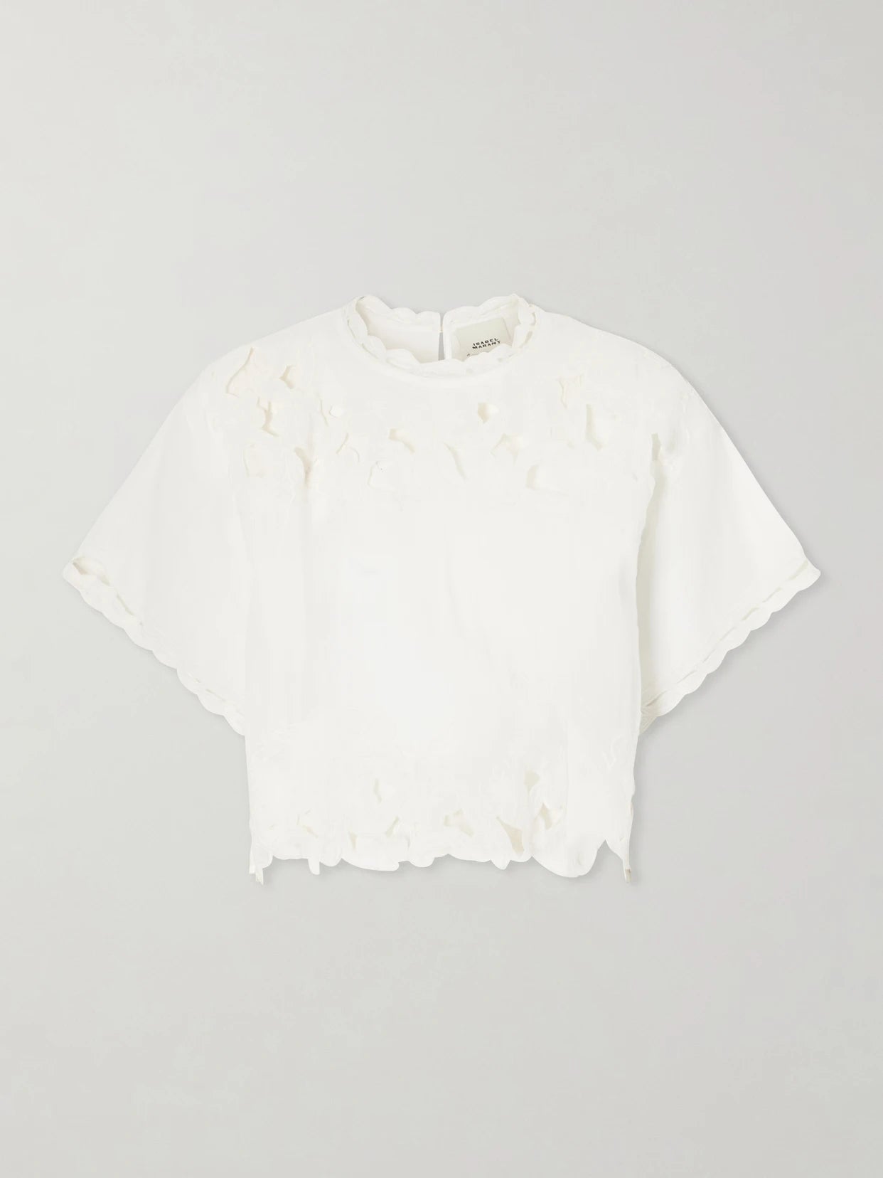 Image of a model wearing Tops. Product name - Relda Cut-out Ramie Blouse in White colour by brand - ISABEL MARANT
