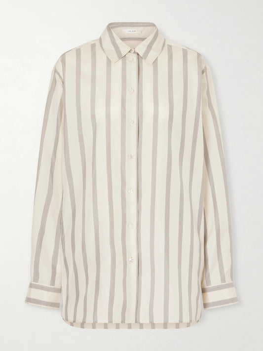 Image of a model wearing Tops. Product name - Sisilia Oversized Pinstriped Silk-twill Shirt in Beige colour by brand - The Row