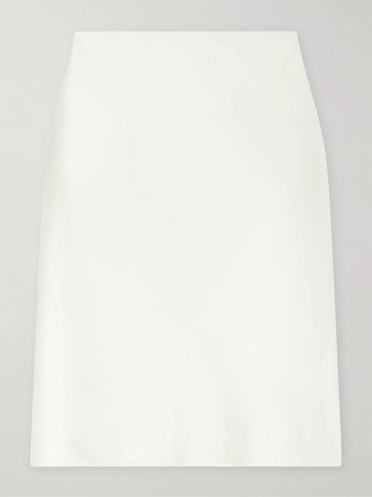 Image of a model wearing Skirts. Product name - Barb Satin Midi Skirt in Cream colour by brand - LESET