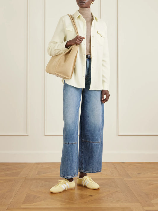 Image of a model wearing Tops. Product name - Cashmere Shirt in Pastel yellow colour by brand - God's True Cashmere