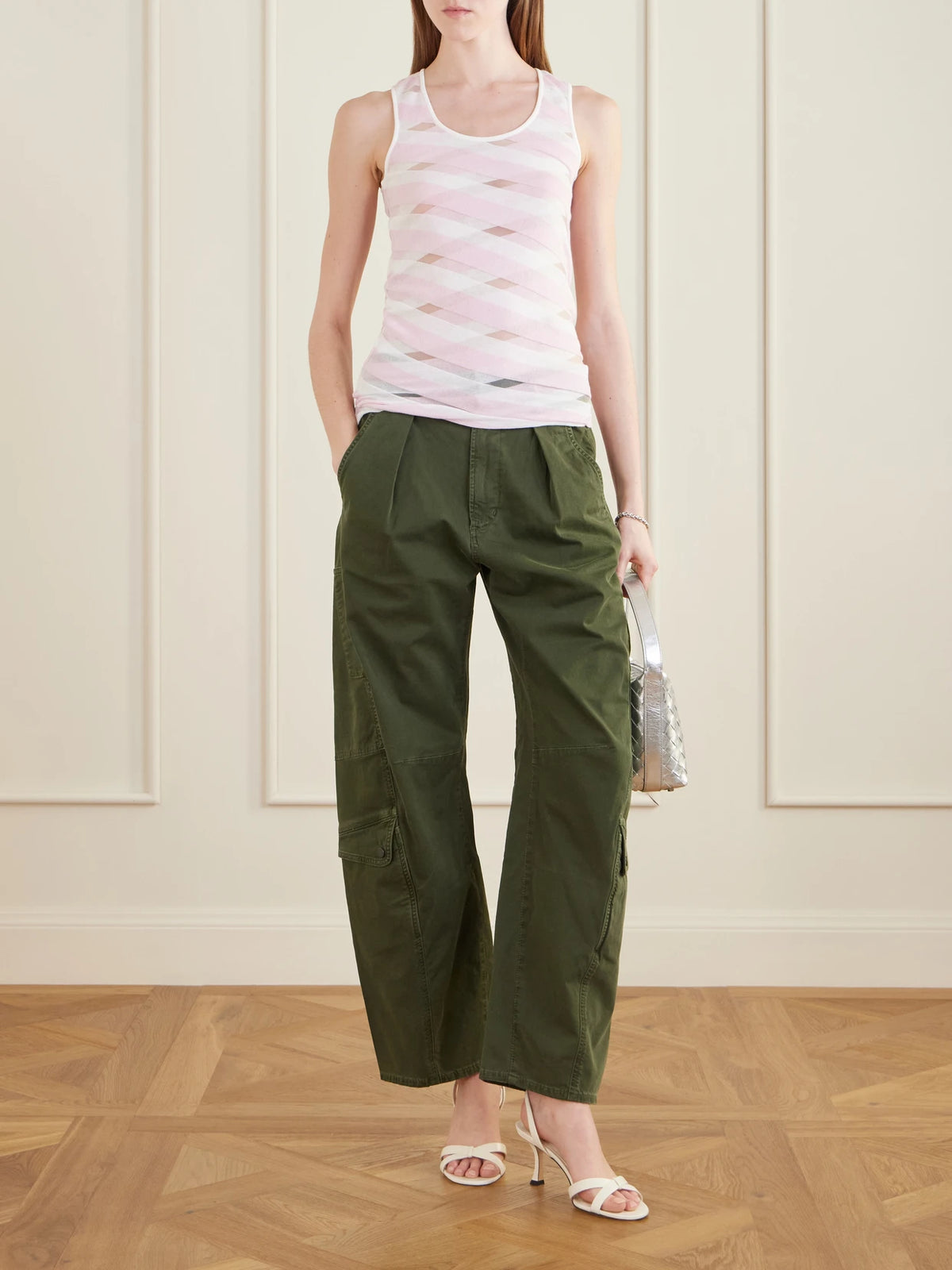 Image of a model wearing Tops. Product name - Striped Mesh-paneled Cotton-blend Tank Top in Pink colour by brand - Stella McCartney