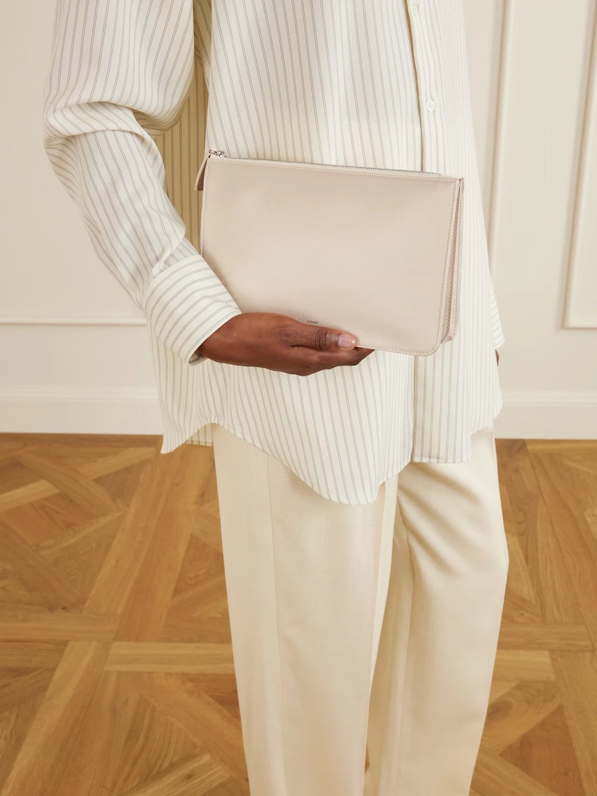 Image of Bags. Product name - Threefold Satin Clutch in Off-white colour by brand - TOTEME