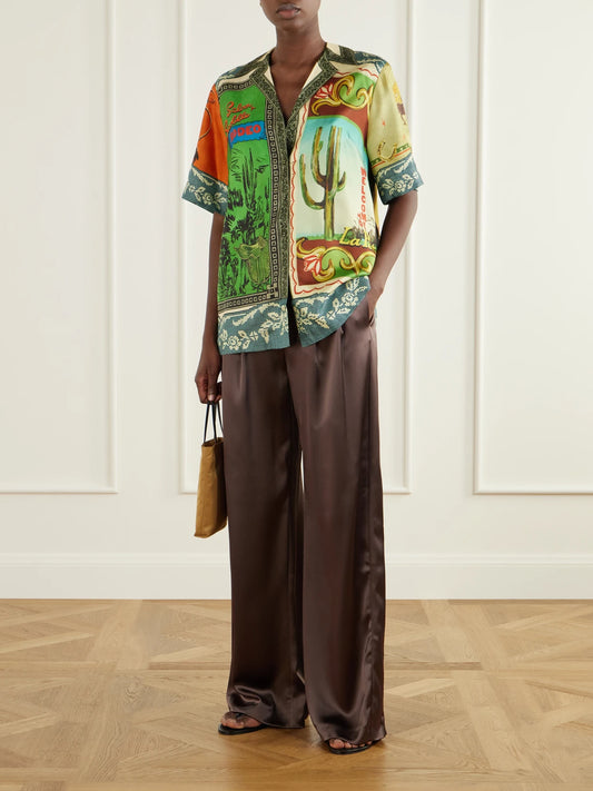 Image of a model wearing Tops. Product name - Ace Printed Silk-twill Shirt in Green colour by brand - ALÉMAIS