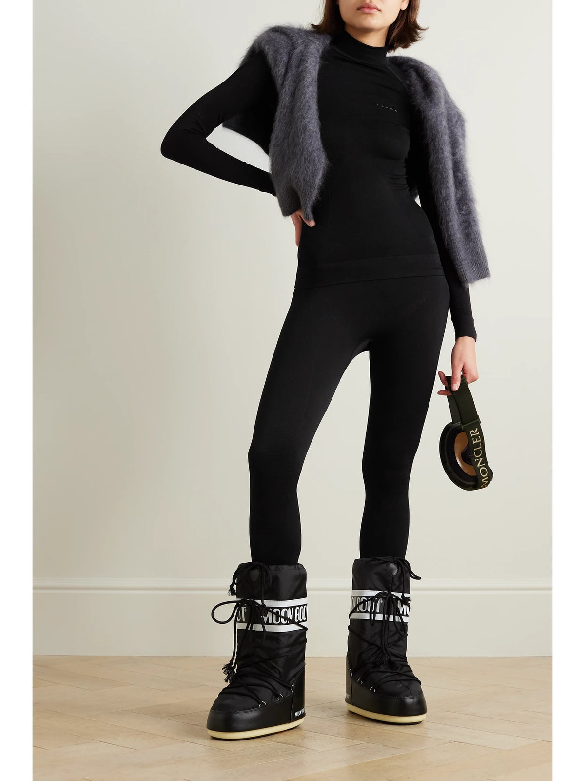 Image of a model wearing Pants. Product name - Maximum Warm Stretch-jersey Leggings in Black colour by brand - FALKE Ergonomic Sport System