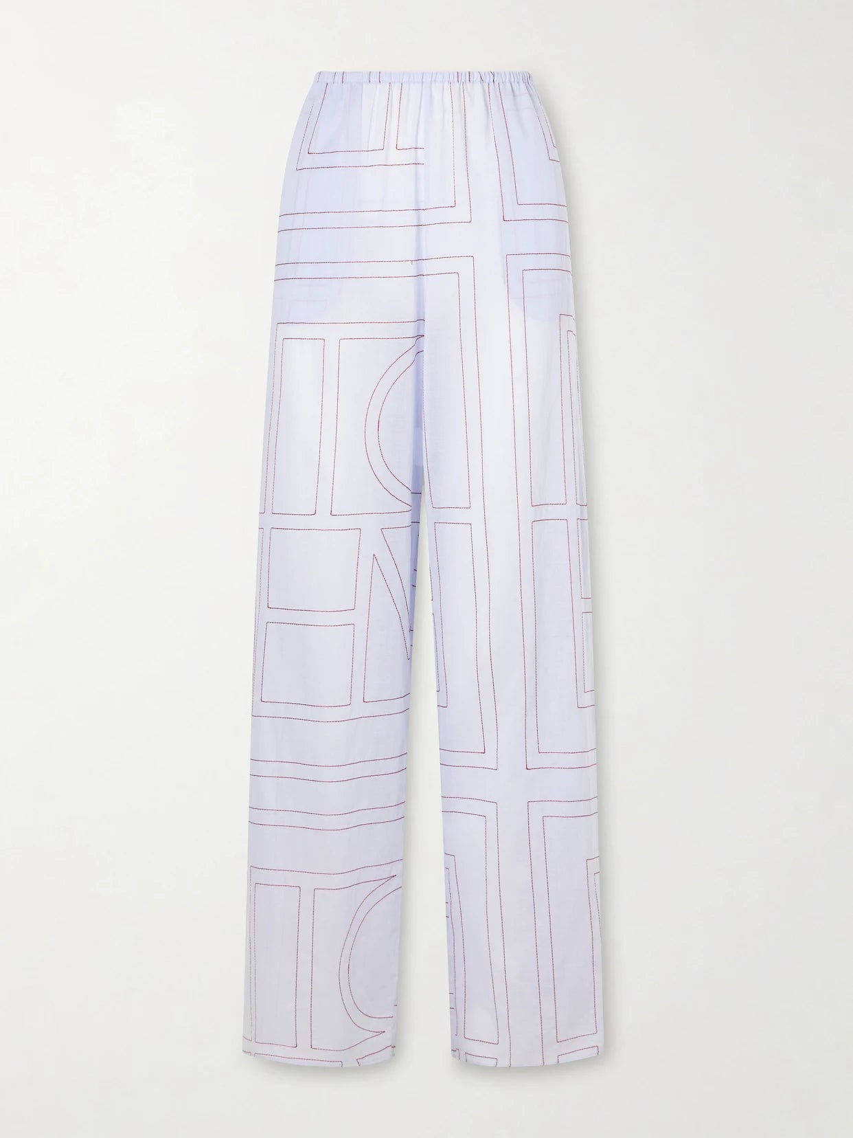 Image of a model wearing Pants. Product name - Embroidered Lyocell And Cotton-blend Wide-leg Pajama Pants in Light blue colour by brand - TOTEME