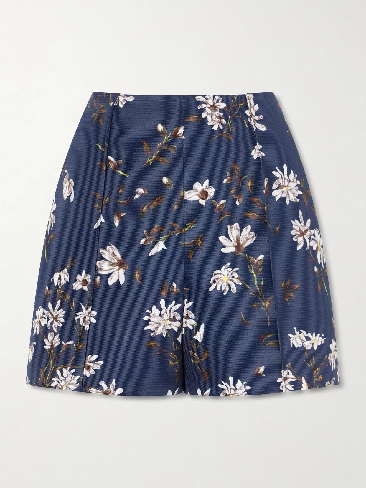 Image of a model wearing Shorts. Product name - + Manolo Blahnik Floral-print Drill Shorts in Navy colour by brand - Emilia Wickstead