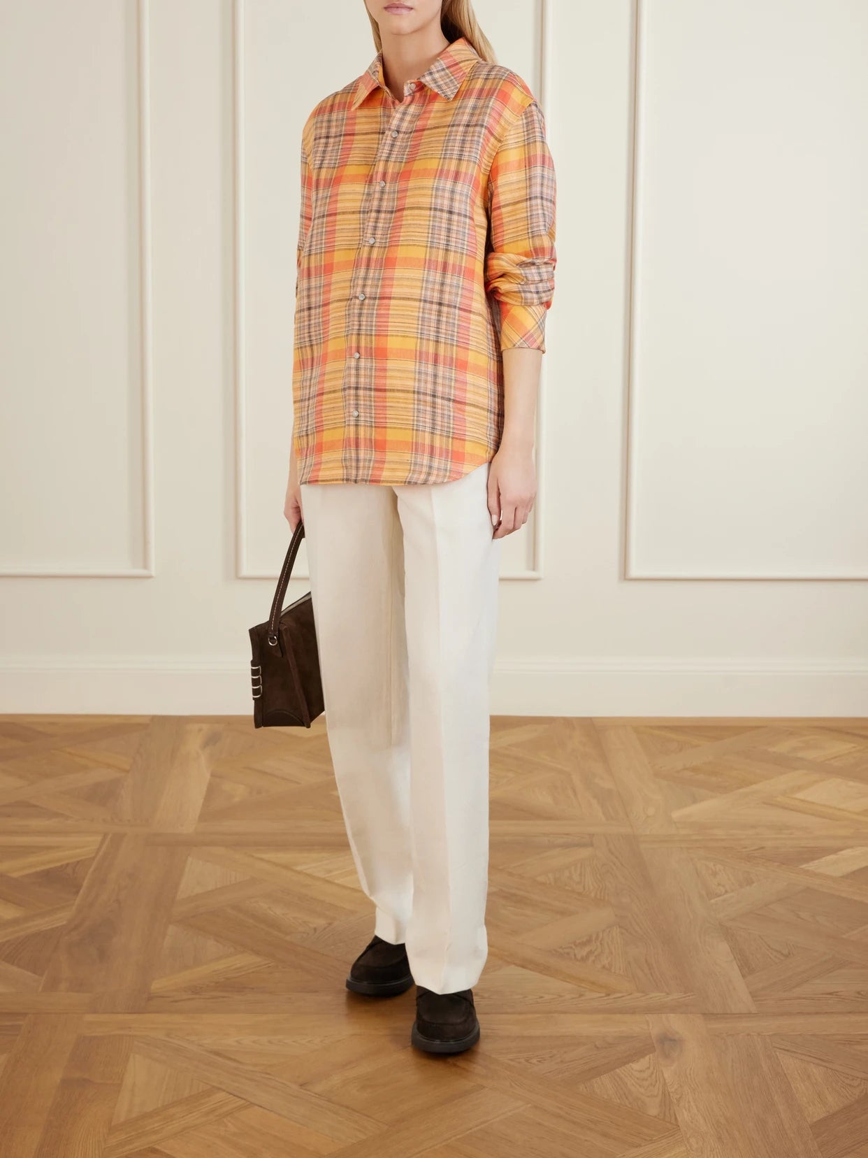 Image of a model wearing Tops. Product name - Twilight Checked Linen Shirt in Orange colour by brand - God's True Cashmere
