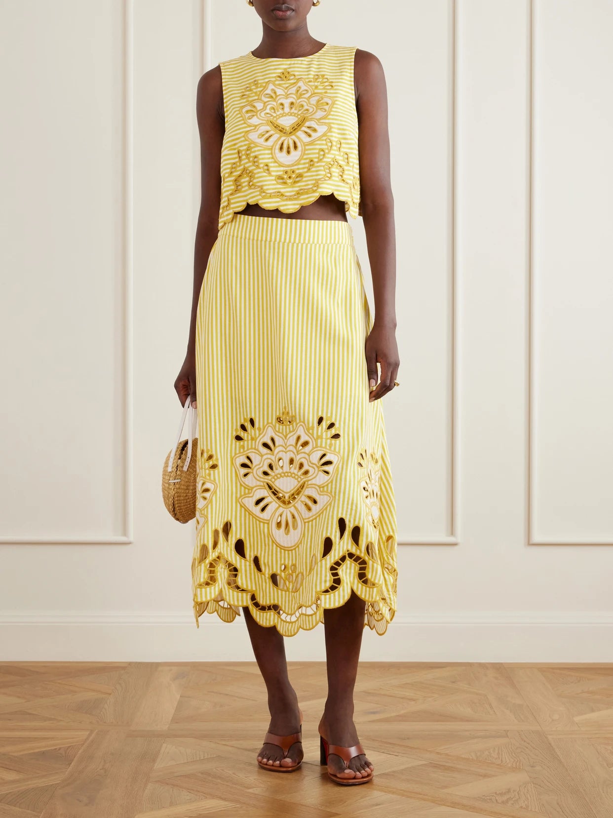 Image of a model wearing Tops. Product name - Cropped Striped Broderie Anglaise-trimmed Linen-blend Tank in Yellow colour by brand - Farm Rio
