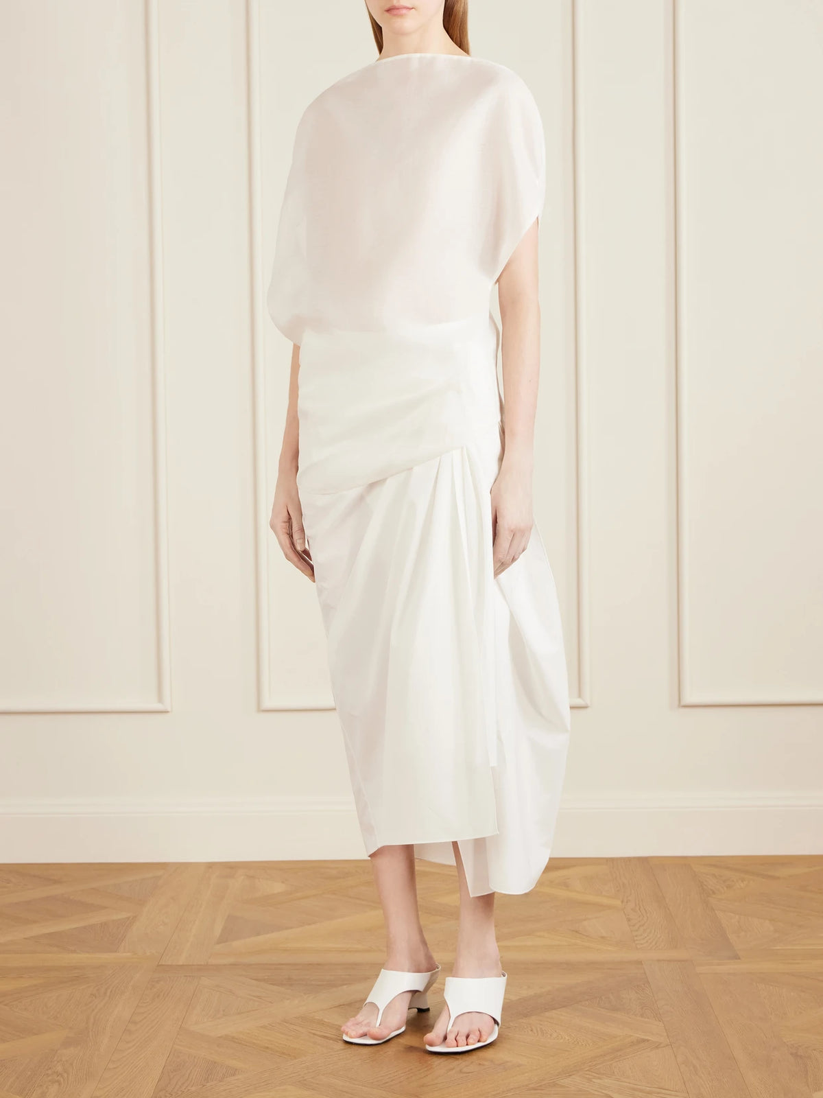 Image of a model wearing Tops. Product name - Poppi Cotton And Silk-blend Blouse in Off-white colour by brand - KHAITE