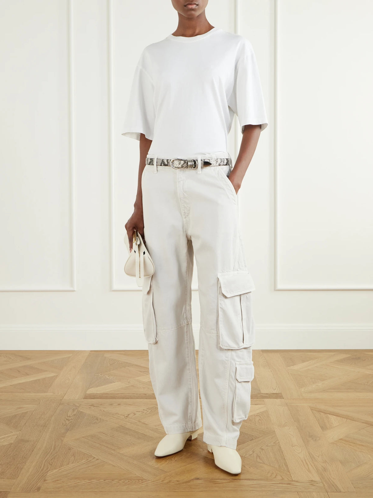 Image of a model wearing Pants. Product name - Ambika Utility Pant High-rise Wide-leg Jeans in Off-white colour by brand - AGOLDE