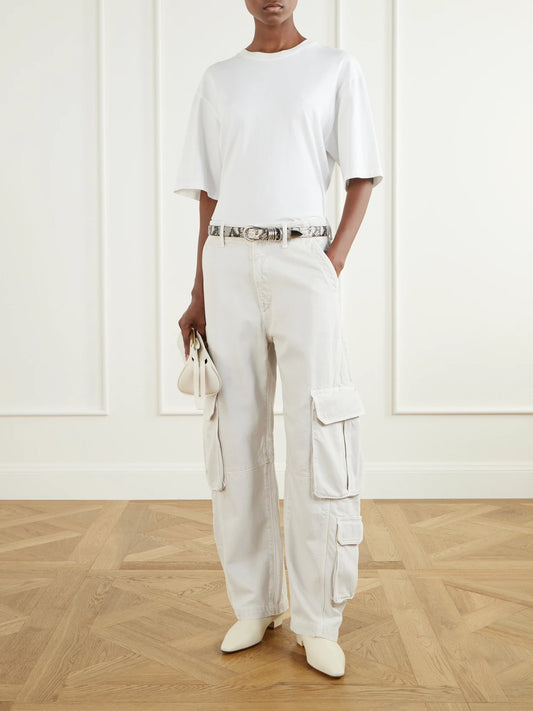 Image of a model wearing Pants. Product name - Ambika Utility Pant High-rise Wide-leg Jeans in Off-white colour by brand - AGOLDE