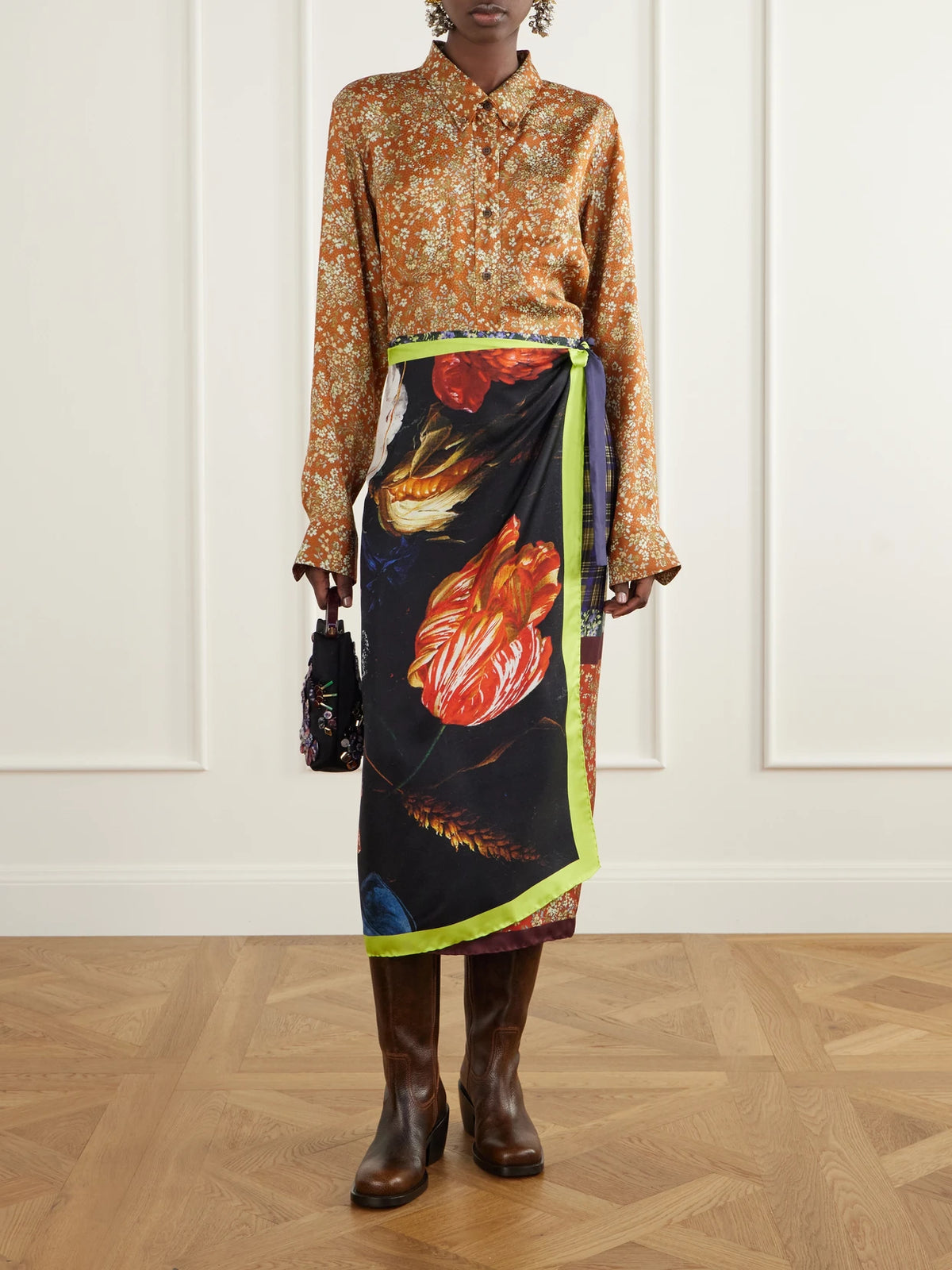 Image of a model wearing Skirts. Product name - Floral-print Silk-satin Wrap Midi Skirt in Multi colour by brand - Dries Van Noten