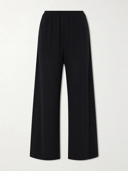 Image of a model wearing Pants. Product name - Cotton And Silk-blend Wide-leg Pants in Black colour by brand - TOTEME