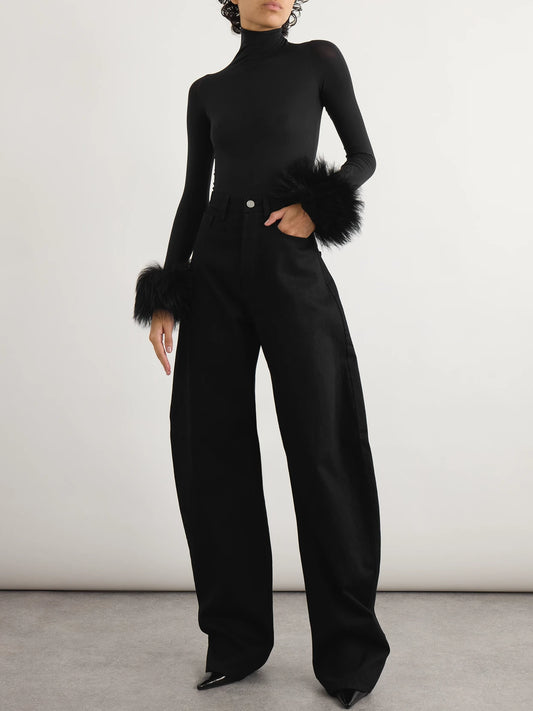 Image of a model wearing Tops. Product name - Shearling-trimmed Stretch-jersey Turtleneck Bodysuit in Black colour by brand - Alaïa