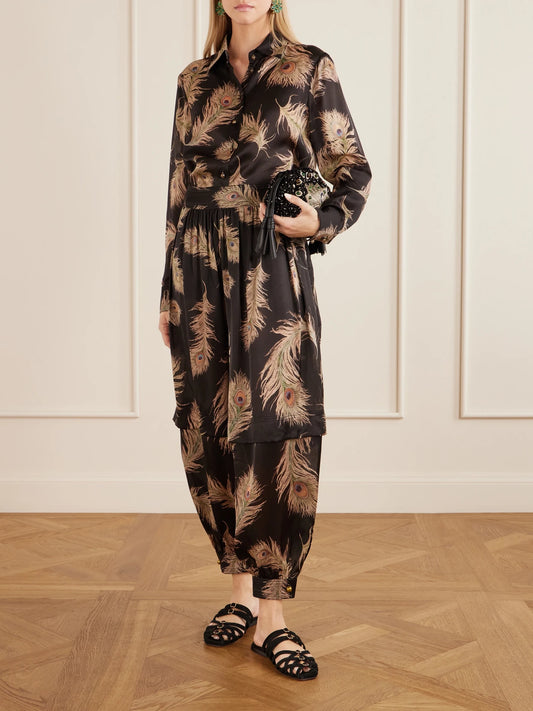 Image of a model wearing Tops. Product name - Valiant Printed Silk-satin Shirt in Black colour by brand - Zimmermann