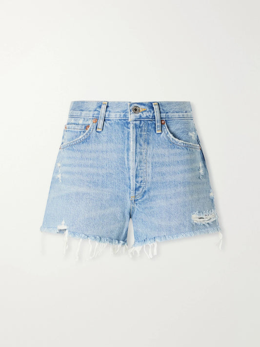 Image of a model wearing Shorts. Product name - Parker Vintage Cutoff Organic Denim Shorts in Light denim colour by brand - AGOLDE