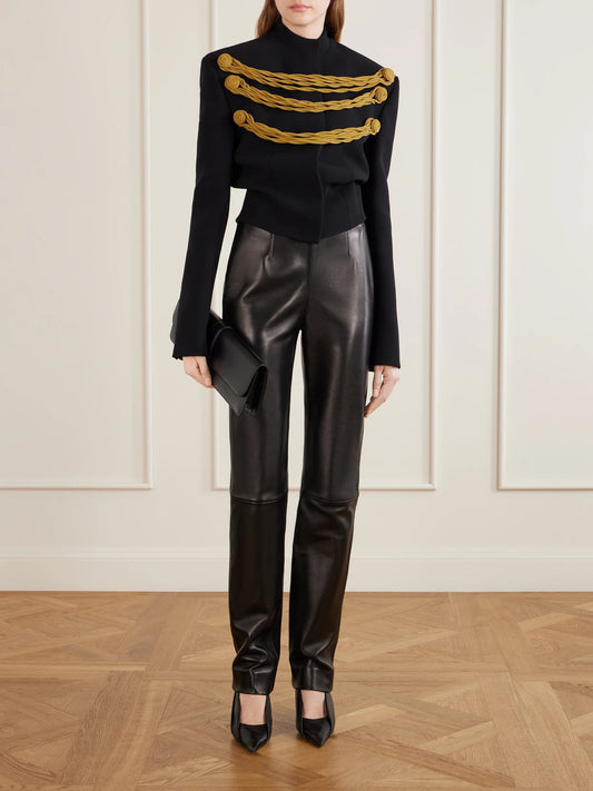 Image of a model wearing Pants. Product name - Ryden Leather Straight-leg Pants in Black colour by brand - KHAITE