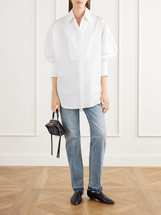 Image of a model wearing Tops. Product name - The Dover Tux Organic Cotton-poplin Shirt in White colour by brand - RÙADH