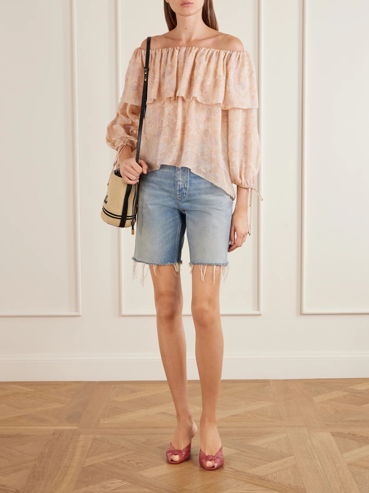 Image of a model wearing Tops. Product name - Off-the-shoulder Ruffled Floral-print Silk-charmeuse Blouse in Pink colour by brand - Chloé