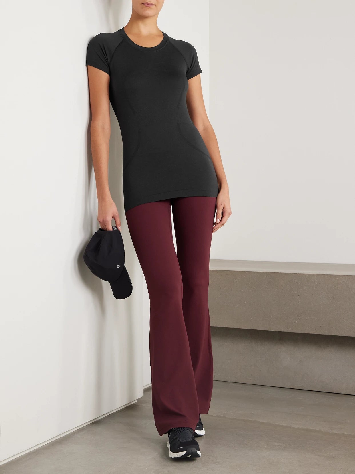 Image of a model wearing Shorts. Product name - Swiftly Tech Short-sleeve Shirt 2.0 - Hip Length in Black colour by brand - lululemon