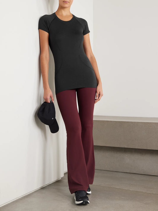 Image of a model wearing Shorts. Product name - Swiftly Tech Short-sleeve Shirt 2.0 - Hip Length in Black colour by brand - lululemon