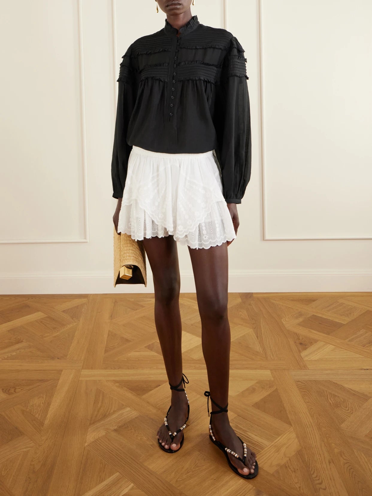 Image of a model wearing Shorts. Product name - Layle Broderie Anglaise Cotton Shorts in White colour by brand - MARANT ÉTOILE