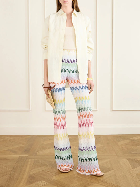 Image of a model wearing Pants. Product name - Striped Metallic Crochet-knit Flared Pants in White colour by brand - Missoni
