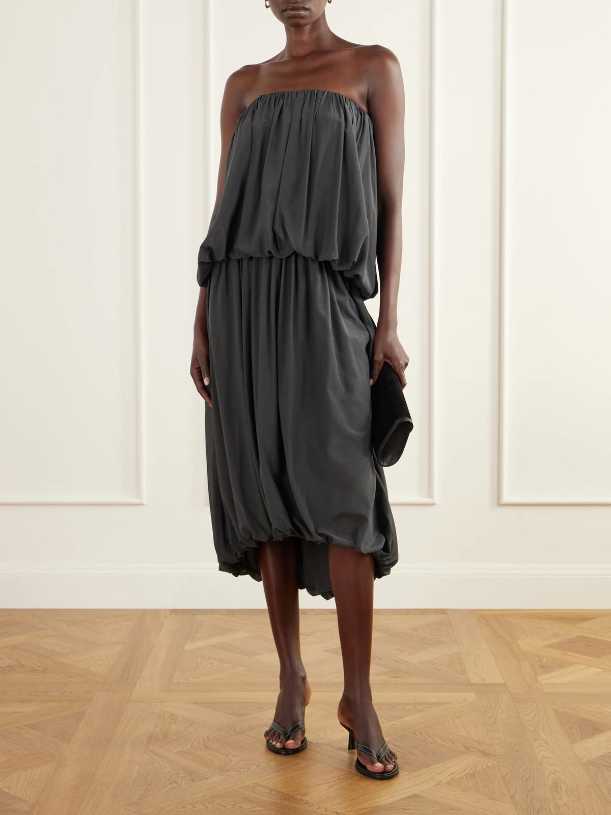 Image of a model wearing Skirts. Product name - Balloon Gathered Chiffon Midi Skirt in Charcoal colour by brand - ST. AGNI