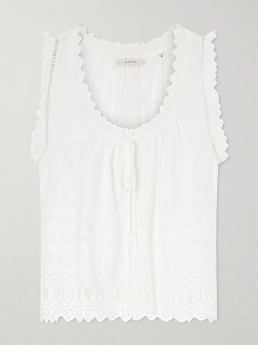 Image of a model wearing Tops. Product name - Toussine Gatehred Broderie Anglaise Cotton Top in White colour by brand - DÔEN