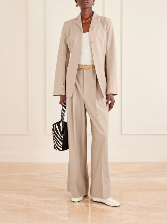 Image of a model wearing Pants. Product name - Fatima Pleated Wool-blend Wide-leg Pants in Beige colour by brand - KALLMEYER