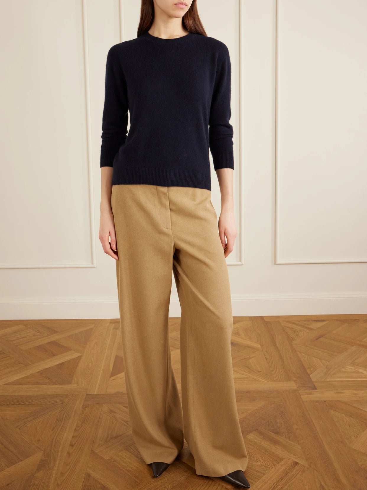 Image of a model wearing Pants. Product name - Dender Silk-twill Wide-leg Pants in Camel colour by brand - The Row