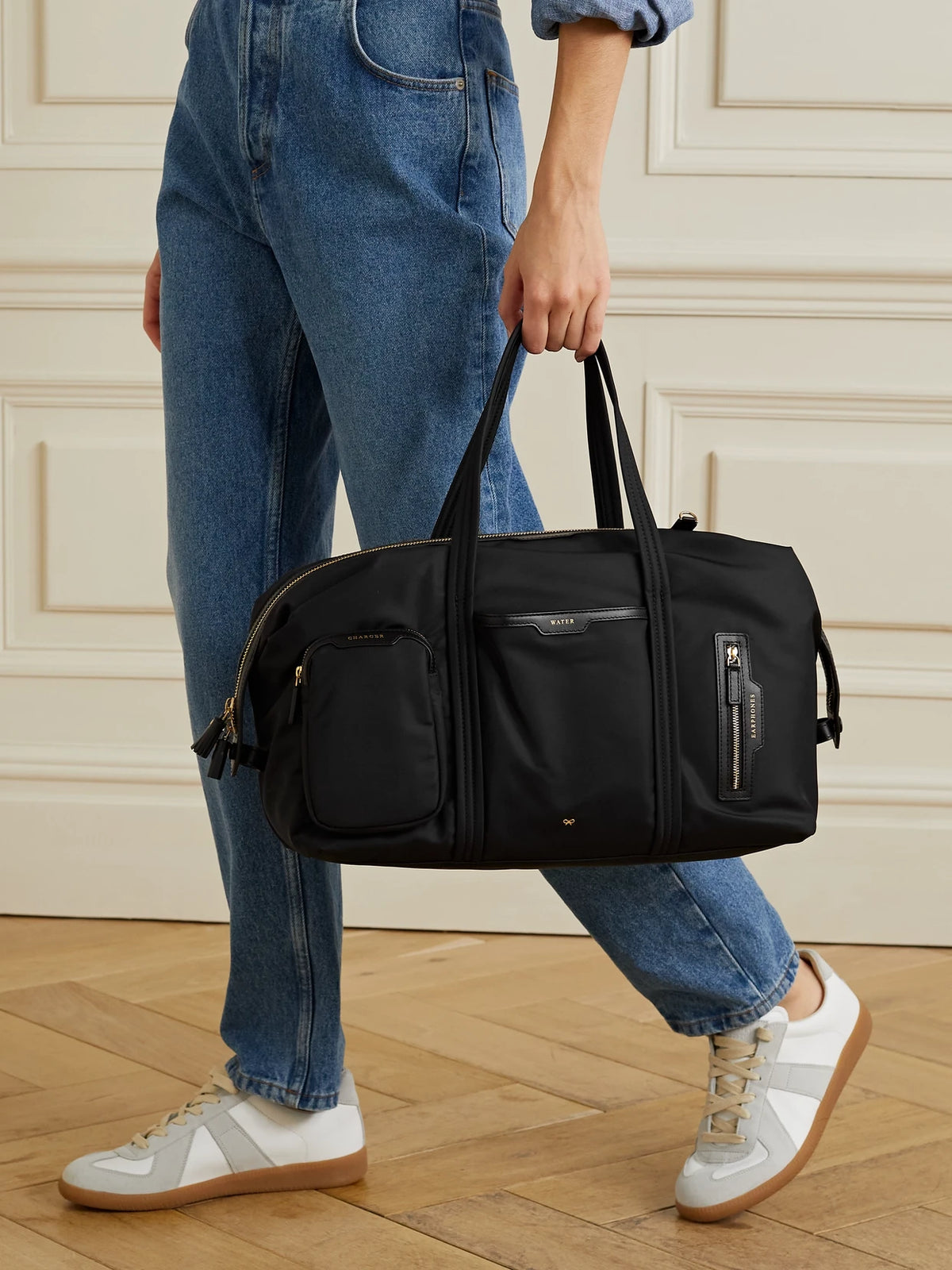 Image of Bags. Product name - Inflight Leather-trimmed Econyl Weekend Bag in Black colour by brand - Anya Hindmarch