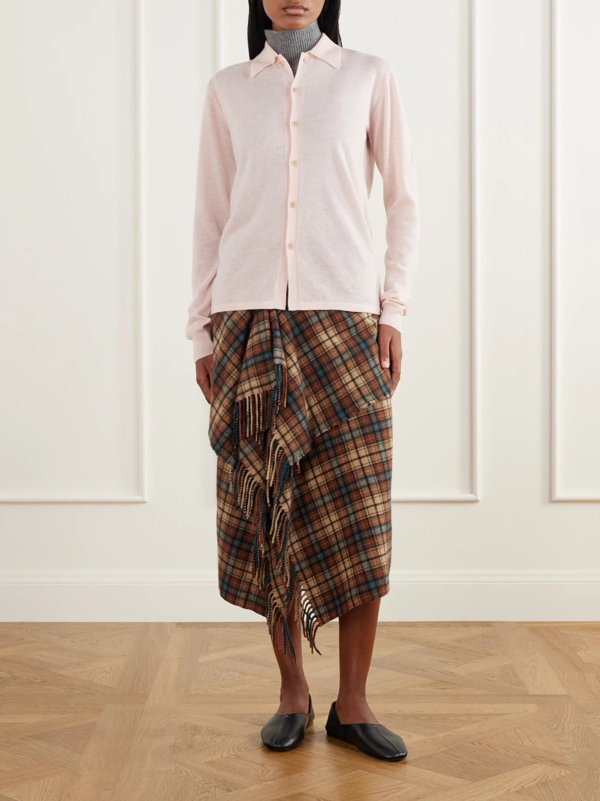 Image of a model wearing Outerwear. Product name - Cashmere Cardigan in Baby pink, Light brown colour by brand - Auralee
