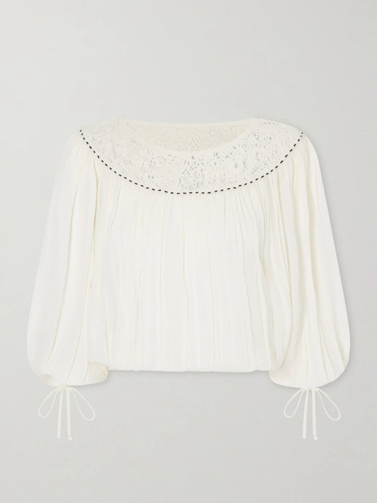 Image of a model wearing Tops. Product name - Nelida Lace-trimmed Silk-gauze Blouse in Ecru colour by brand - ISABEL MARANT