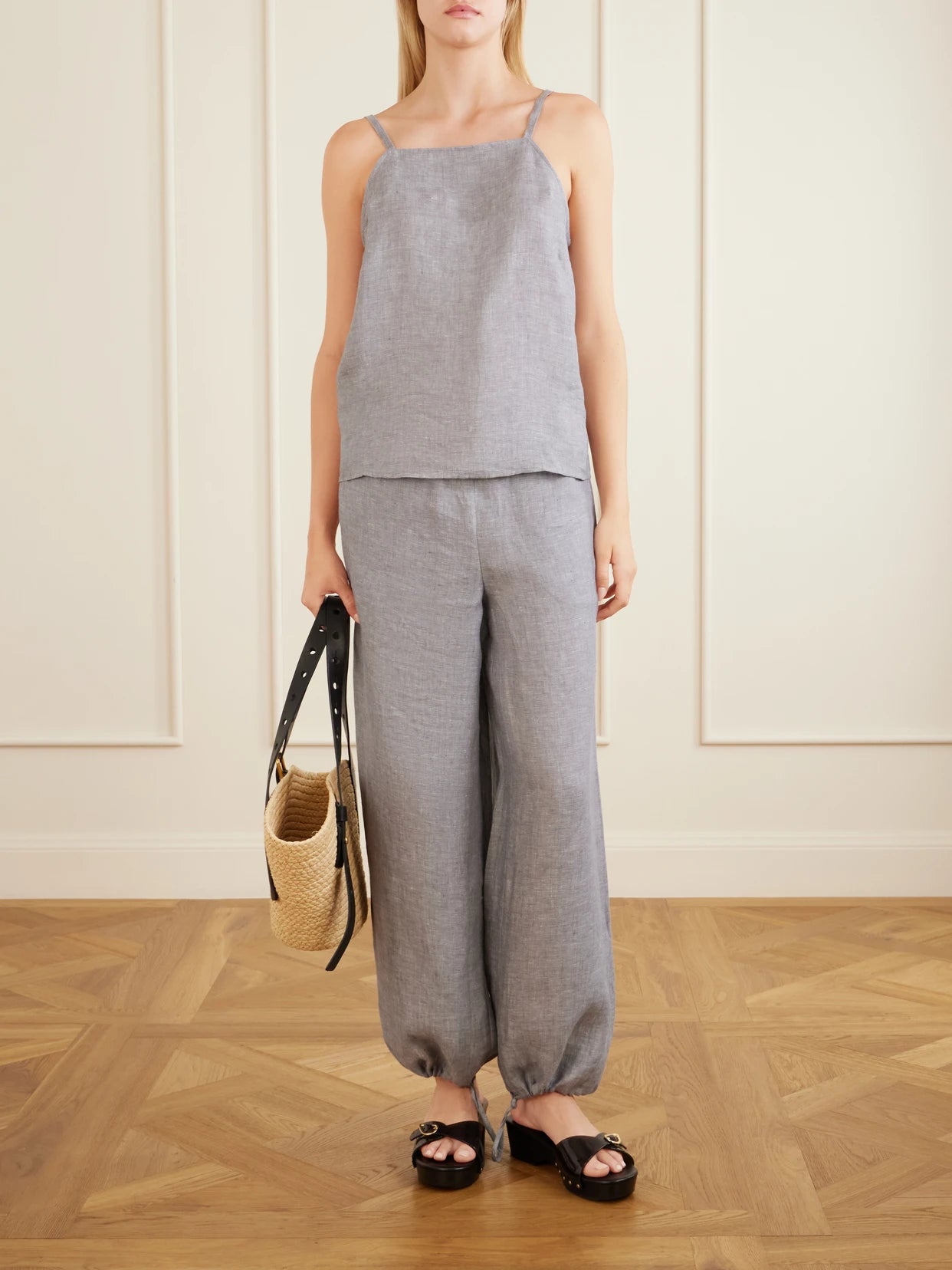 Image of a model wearing Pants. Product name - Bienheureux Linen Straight-leg Drawstring Pants in Gray colour by brand - Eres