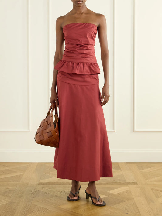 Image of a model wearing Skirts. Product name - Simone Cotton Midi Skirt in Red colour by brand - Faithfull